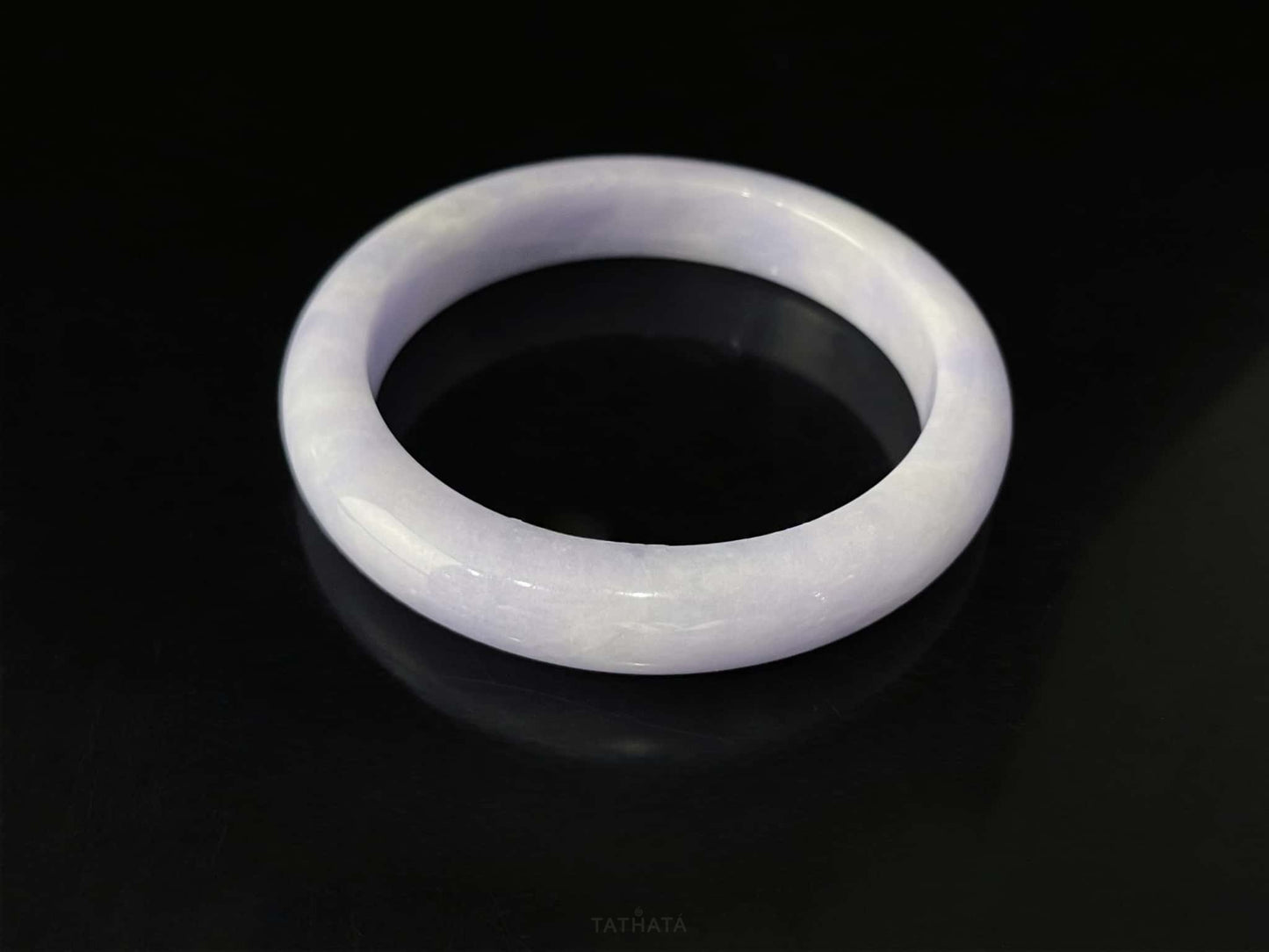 A lilac cloud veil jadeite bangle.