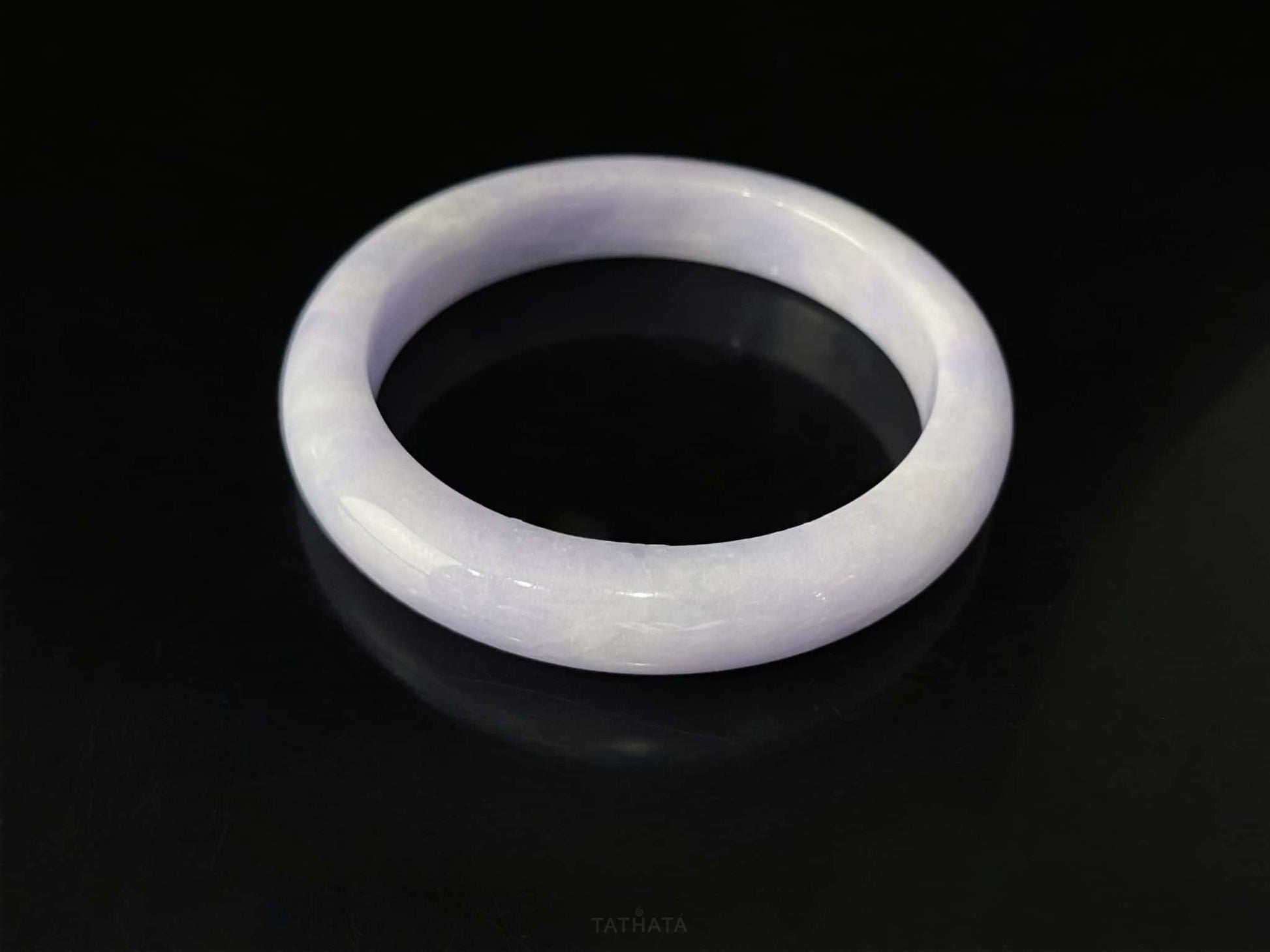 A lilac cloud veil jadeite bangle.