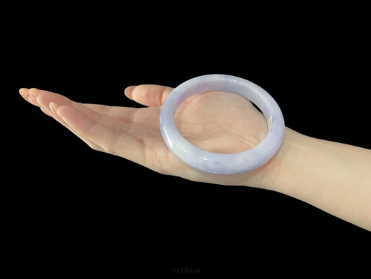A lilac cloud veil jadeite bangle.