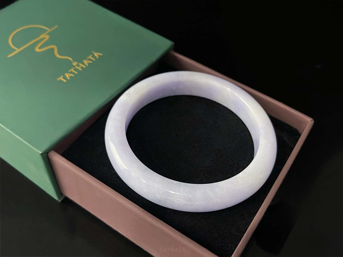 A lilac cloud veil jadeite bangle.