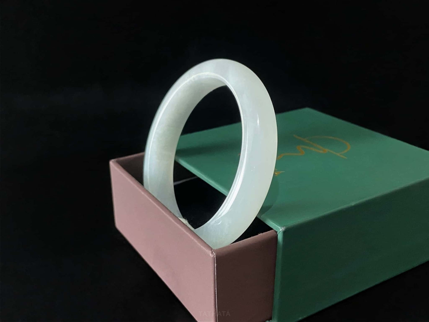 A milky white mist jadeite bangle.