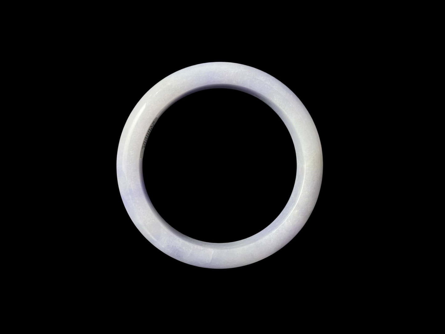 A purple mist shade jadeite bangle.