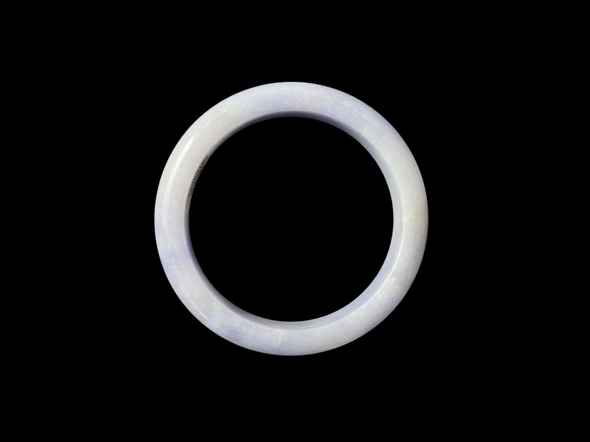 A purple mist shade jadeite bangle.