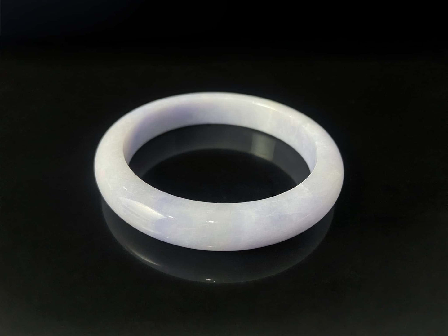 A purple mist shade jadeite bangle.