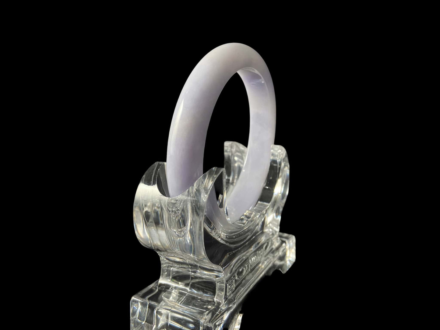 A purple mist shade jadeite bangle.