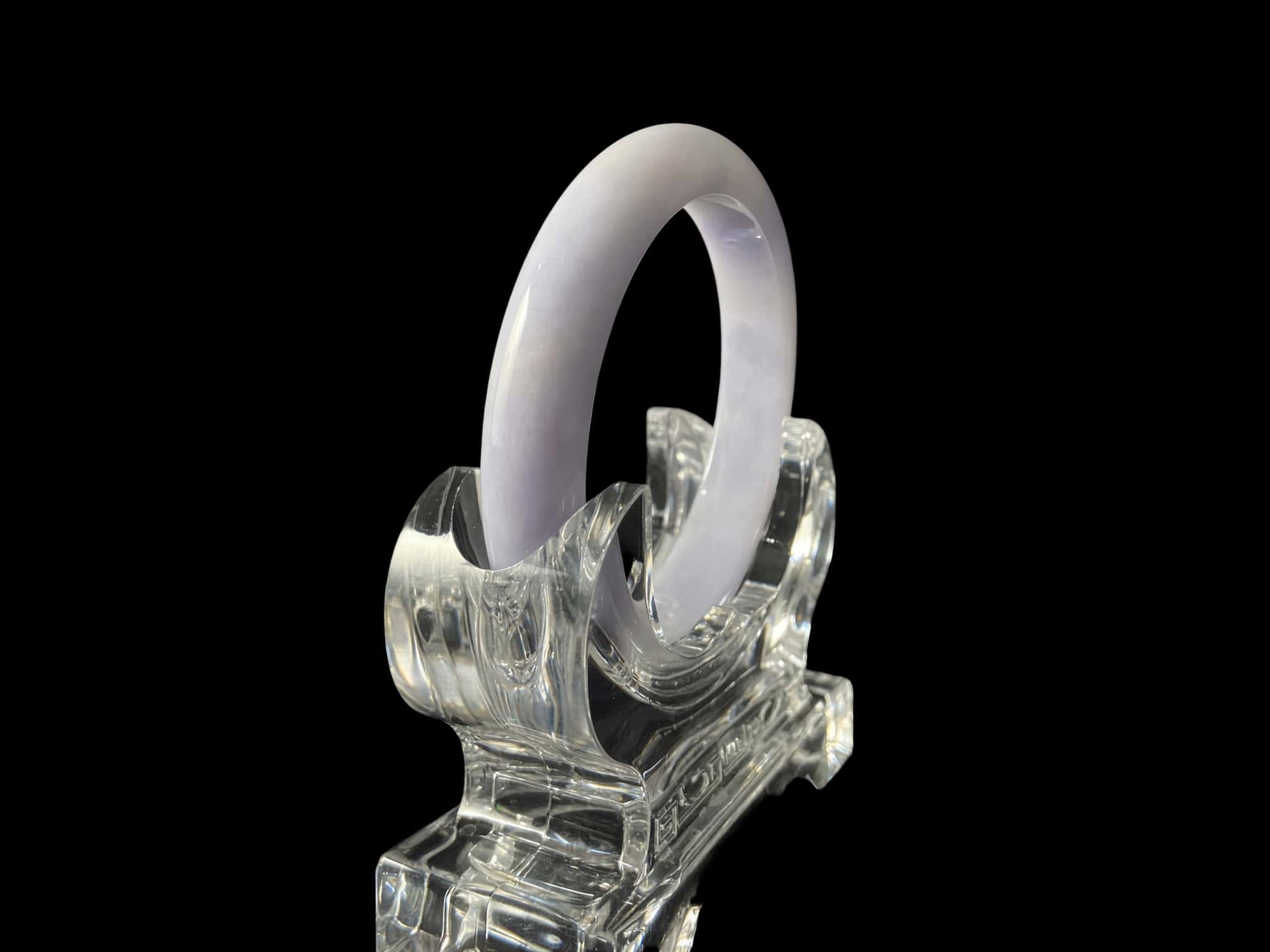 A purple mist shade jadeite bangle.