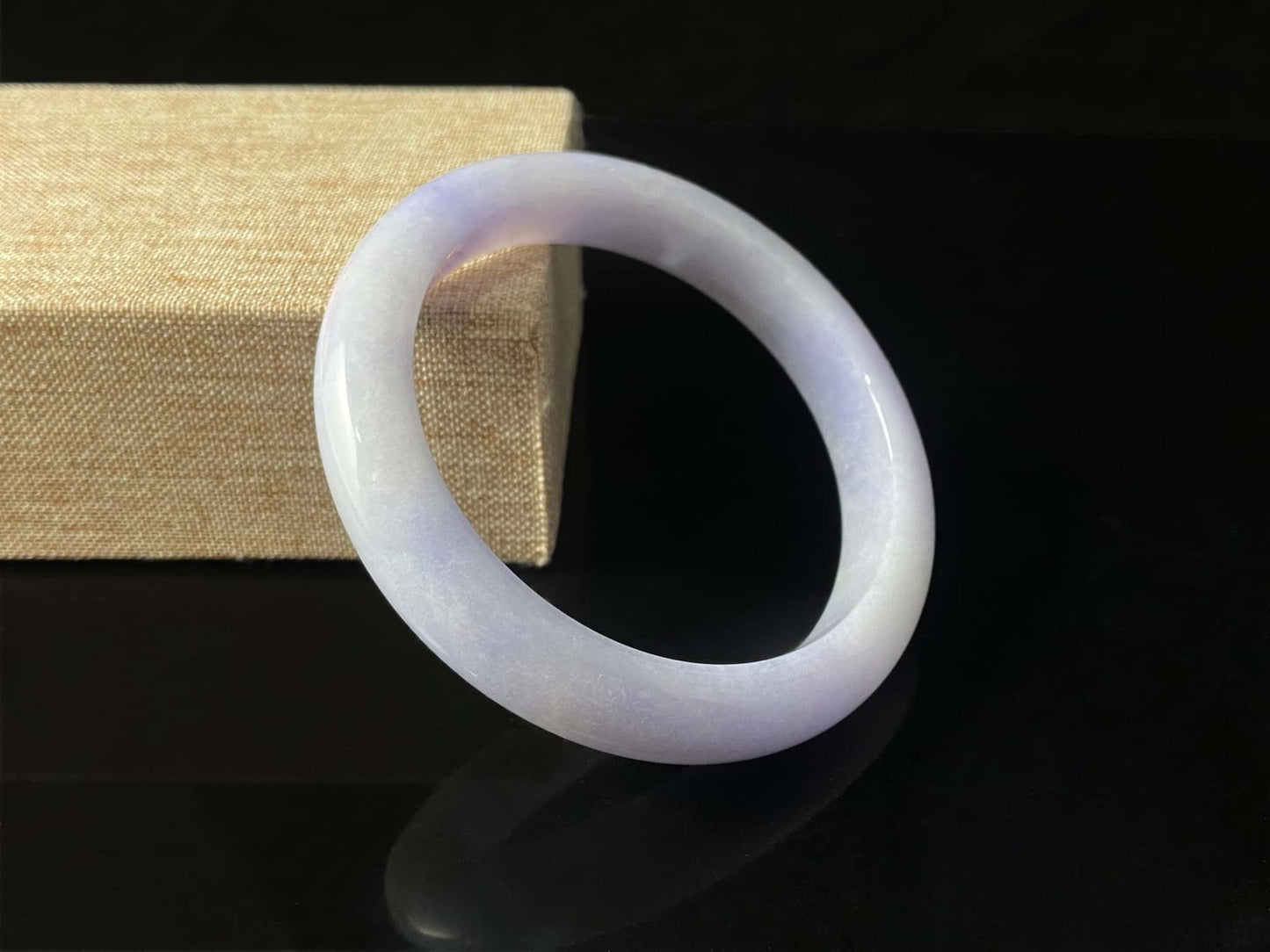 A purple mist shade jadeite bangle.