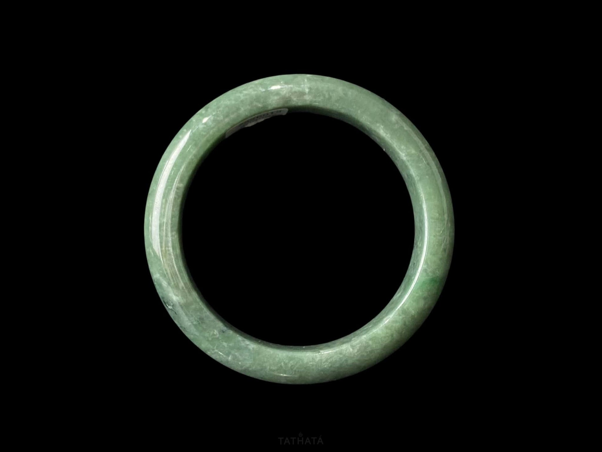 A grass green veil jadeite bangle.