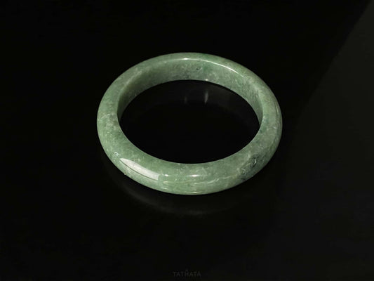 A grass green veil jadeite bangle.