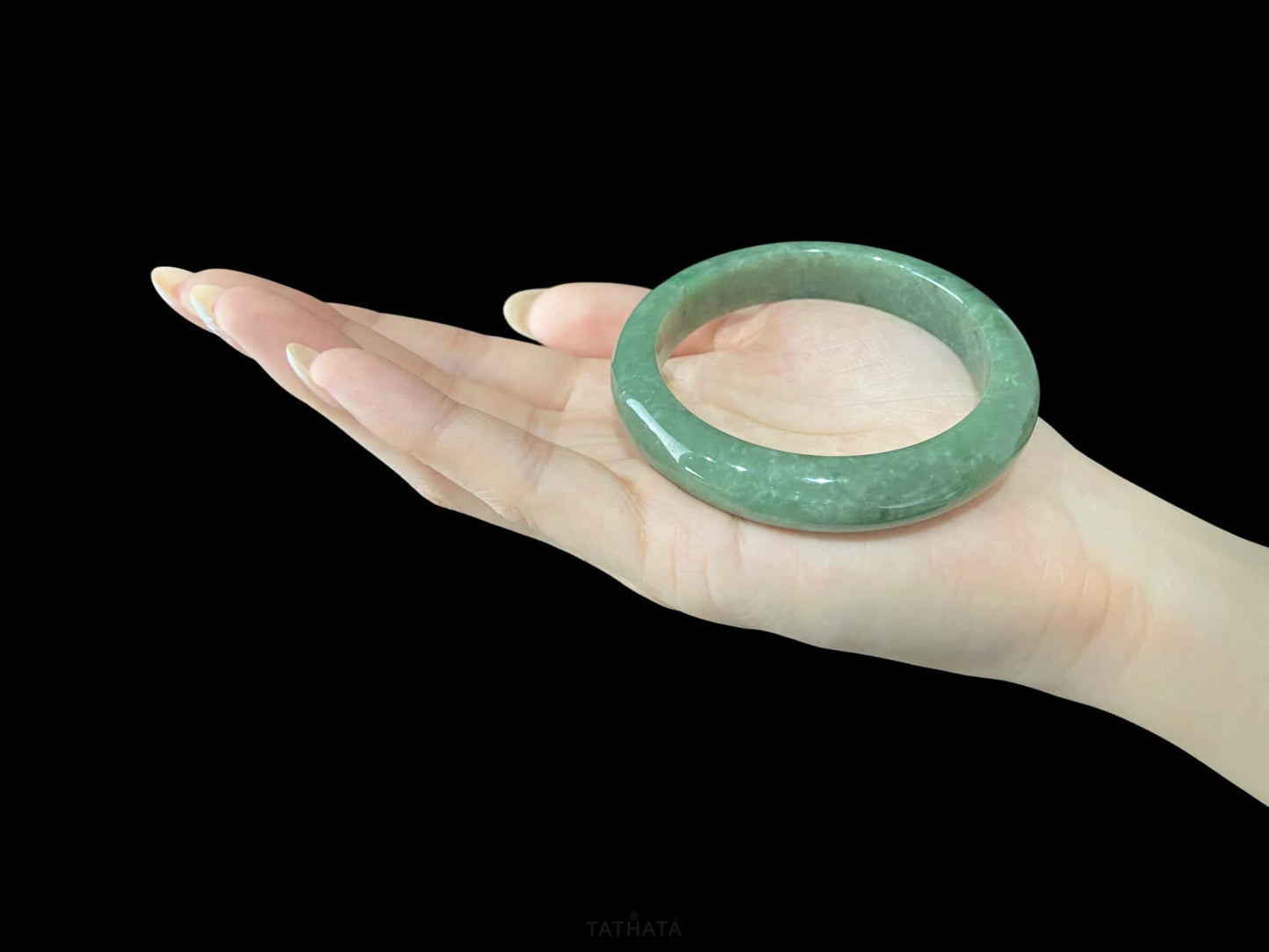 A grass green veil jadeite bangle.