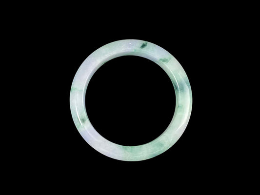 A lilac cloud with floating green jadeite bangle.