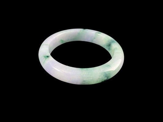 A lilac cloud with floating green jadeite bangle.