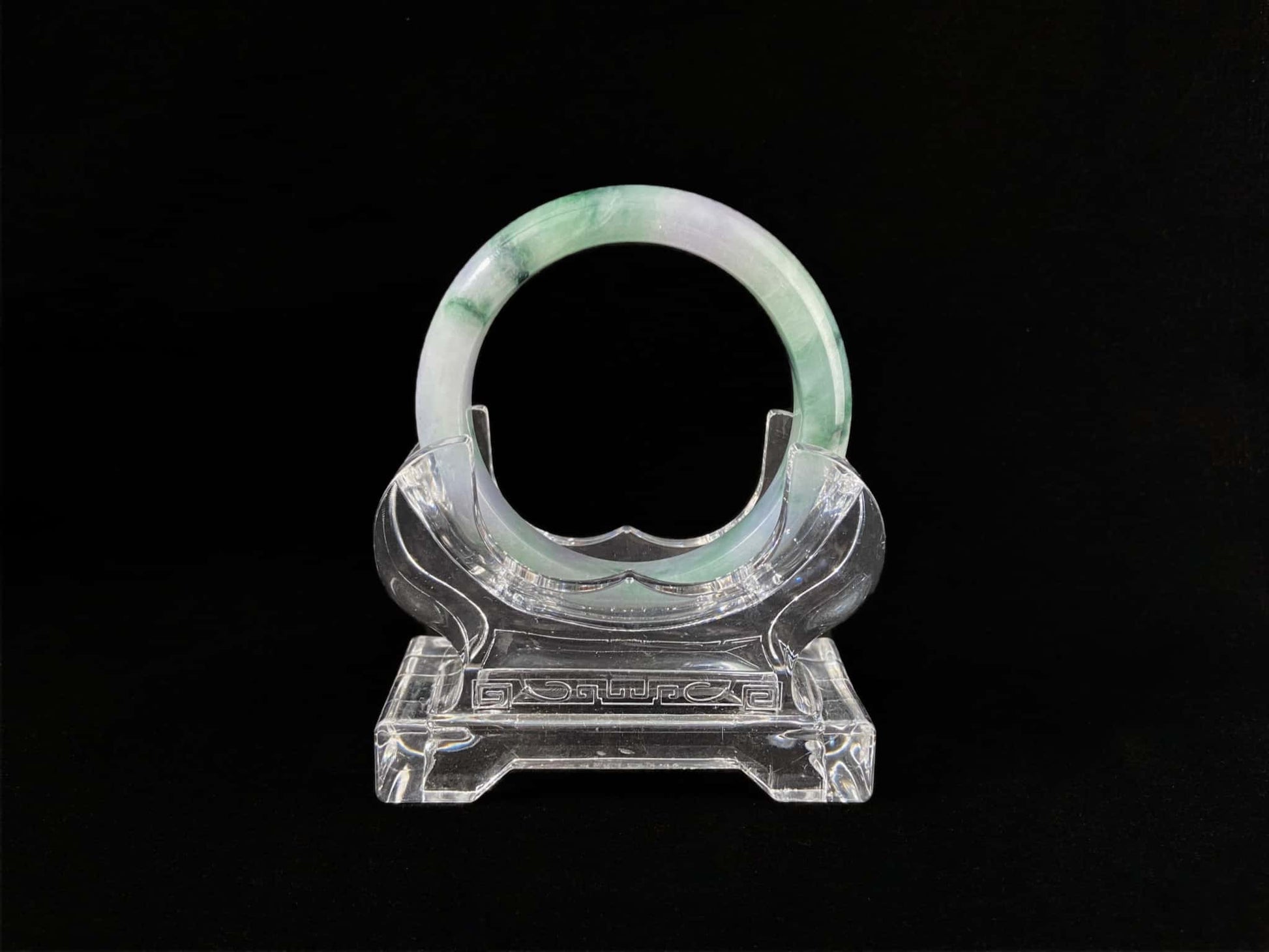A lilac cloud with floating green jadeite bangle.