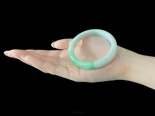 A ivory sprout sheen jadeite bangle.