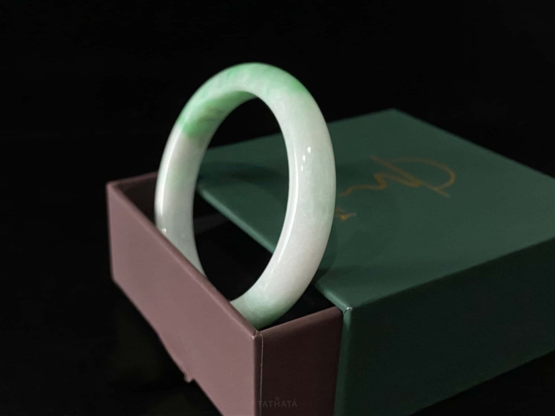 A ivory sprout sheen jadeite bangle.