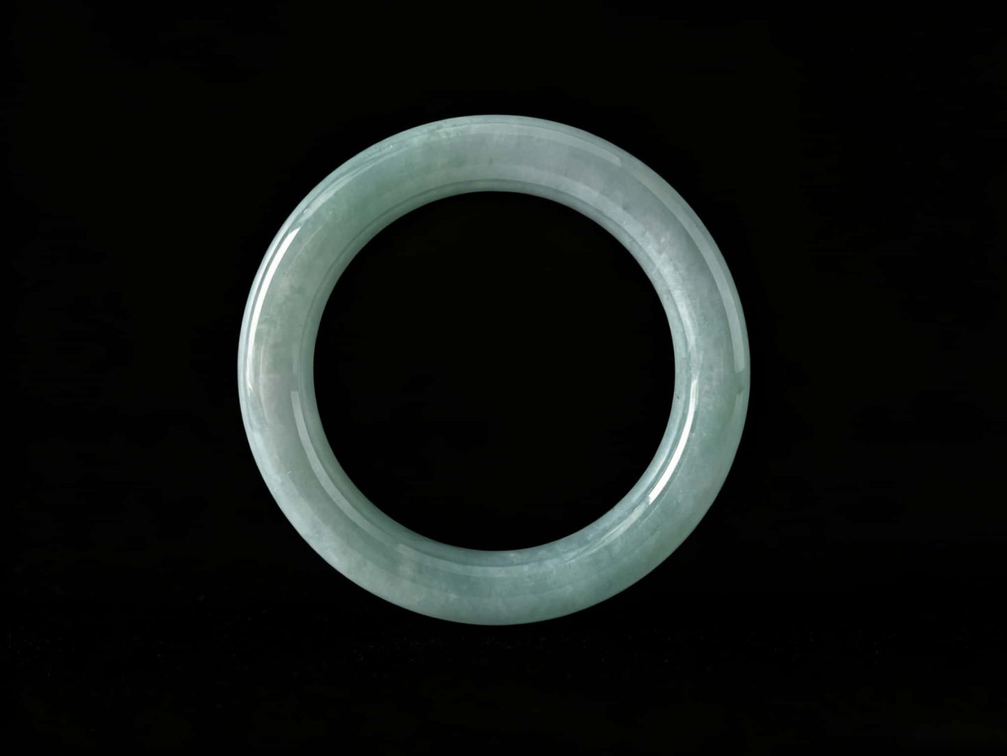 A heavenly blue mist jadeite bangle.