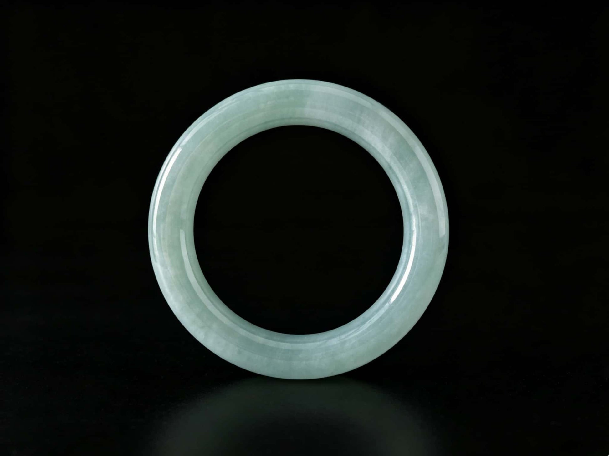 A misty blue dew jadeite bangle.