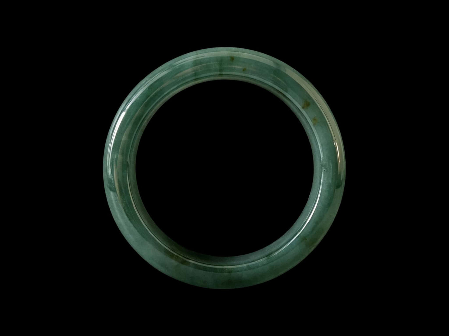 A honey green mist jadeite bangle.
