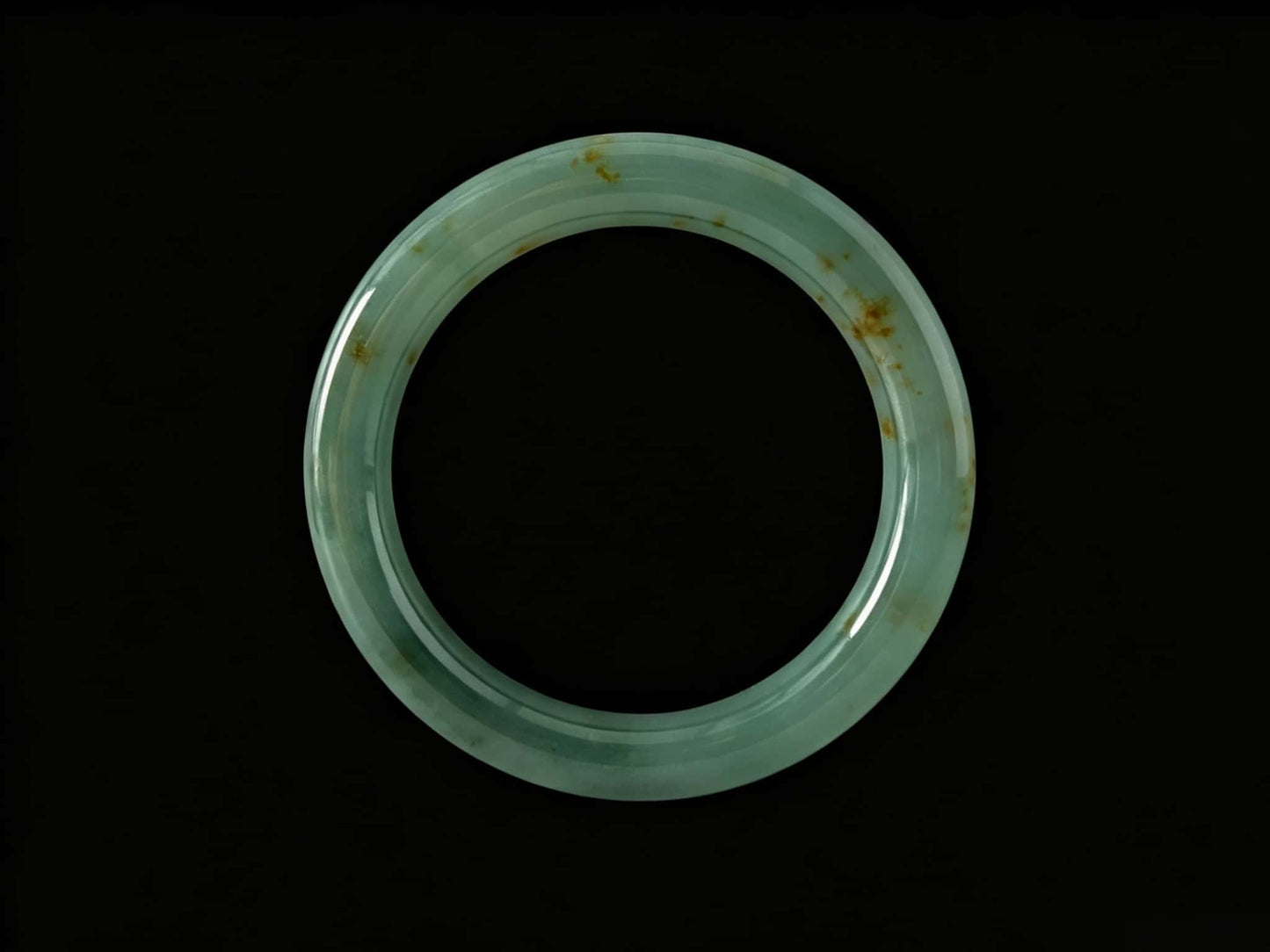 A honey green mist jadeite bangle.