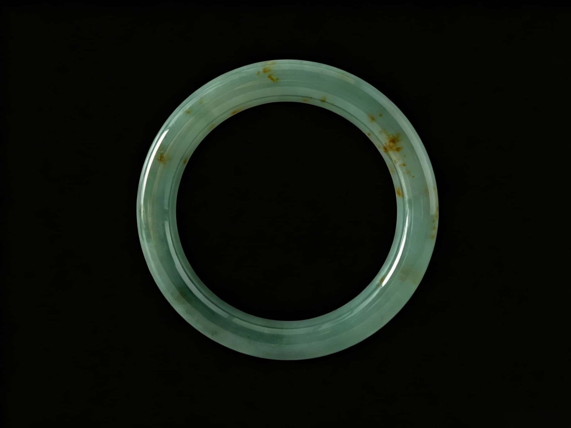 A honey green mist jadeite bangle.