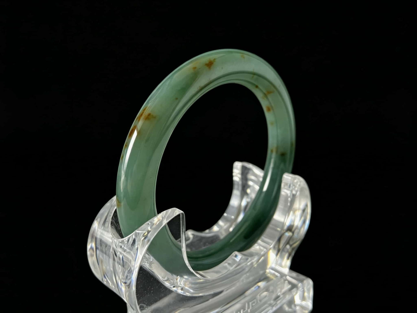 A honey green mist jadeite bangle.