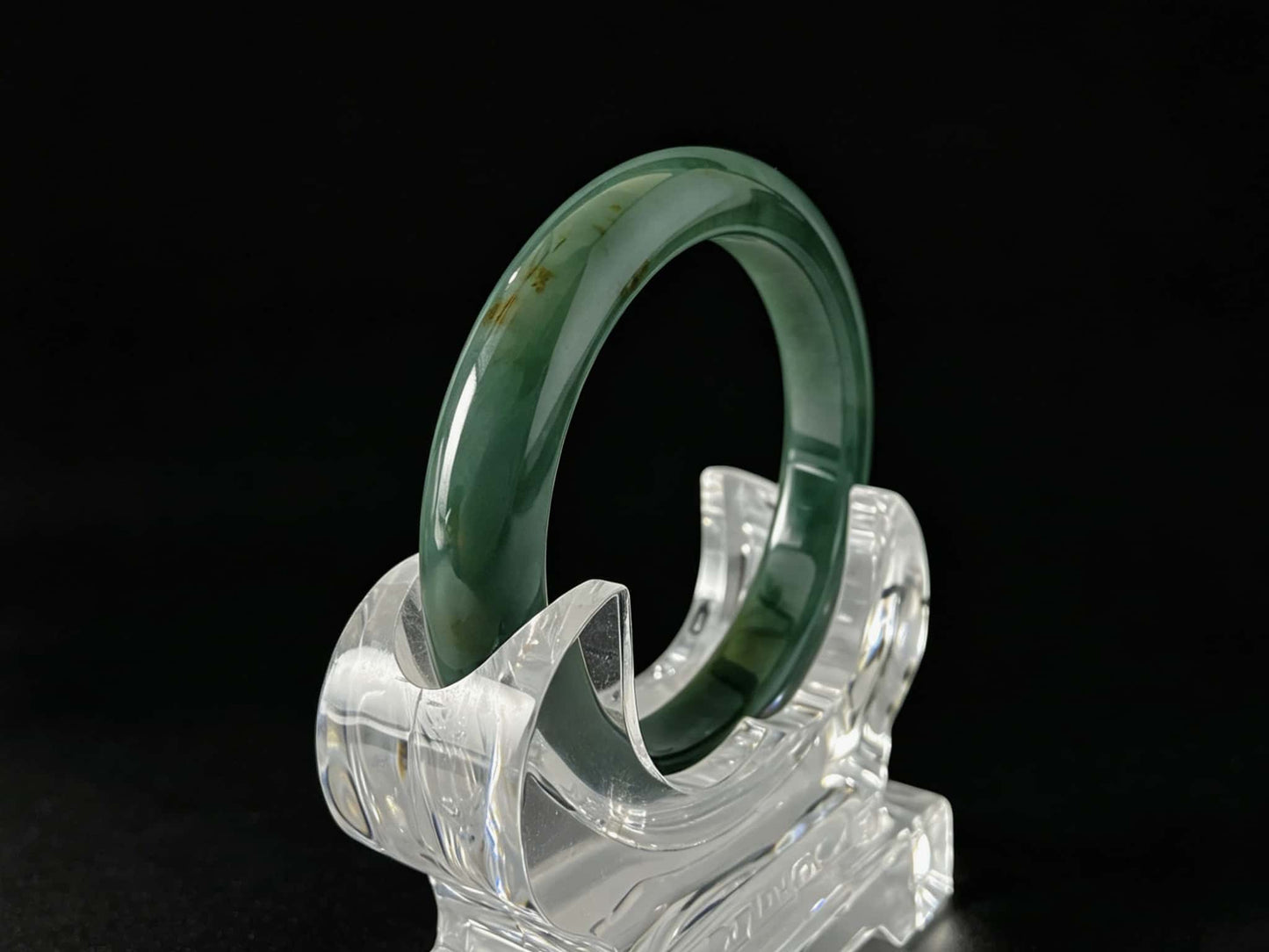 A honey green mist jadeite bangle.