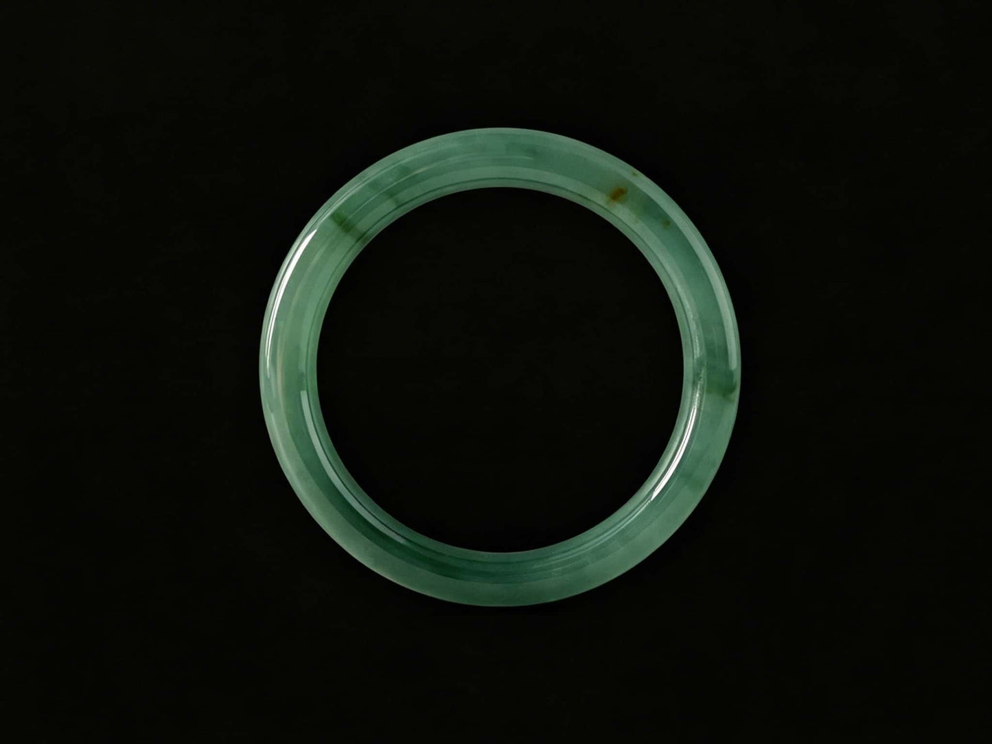 A honey green mist jadeite bangle.