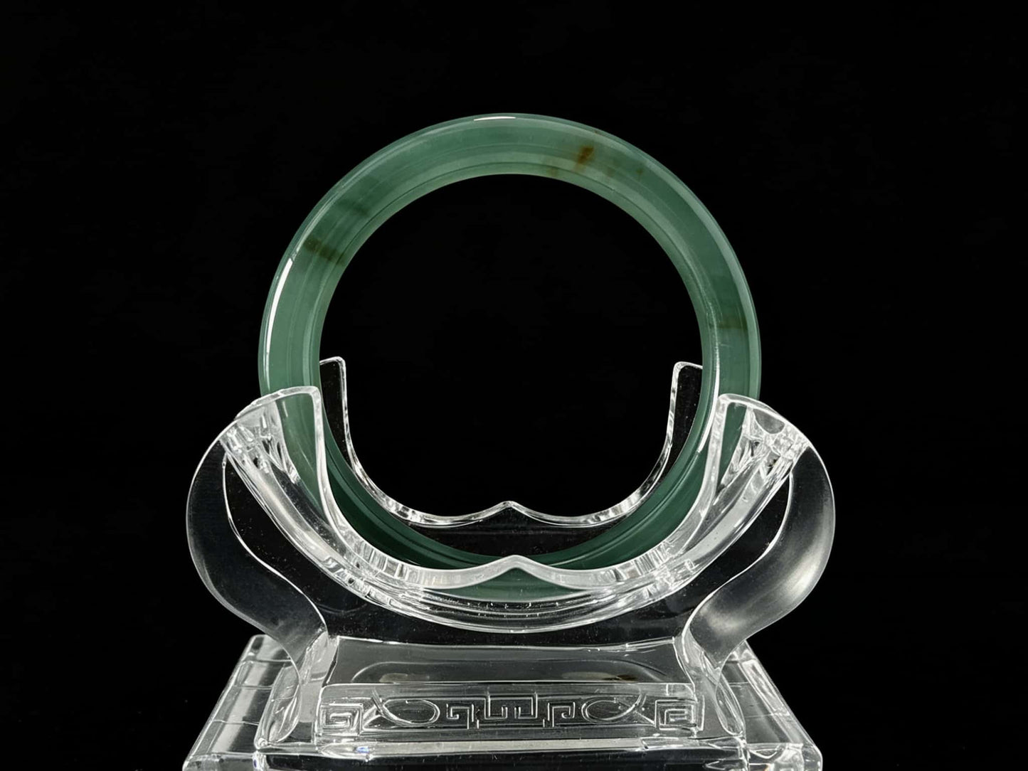 A honey green mist jadeite bangle.