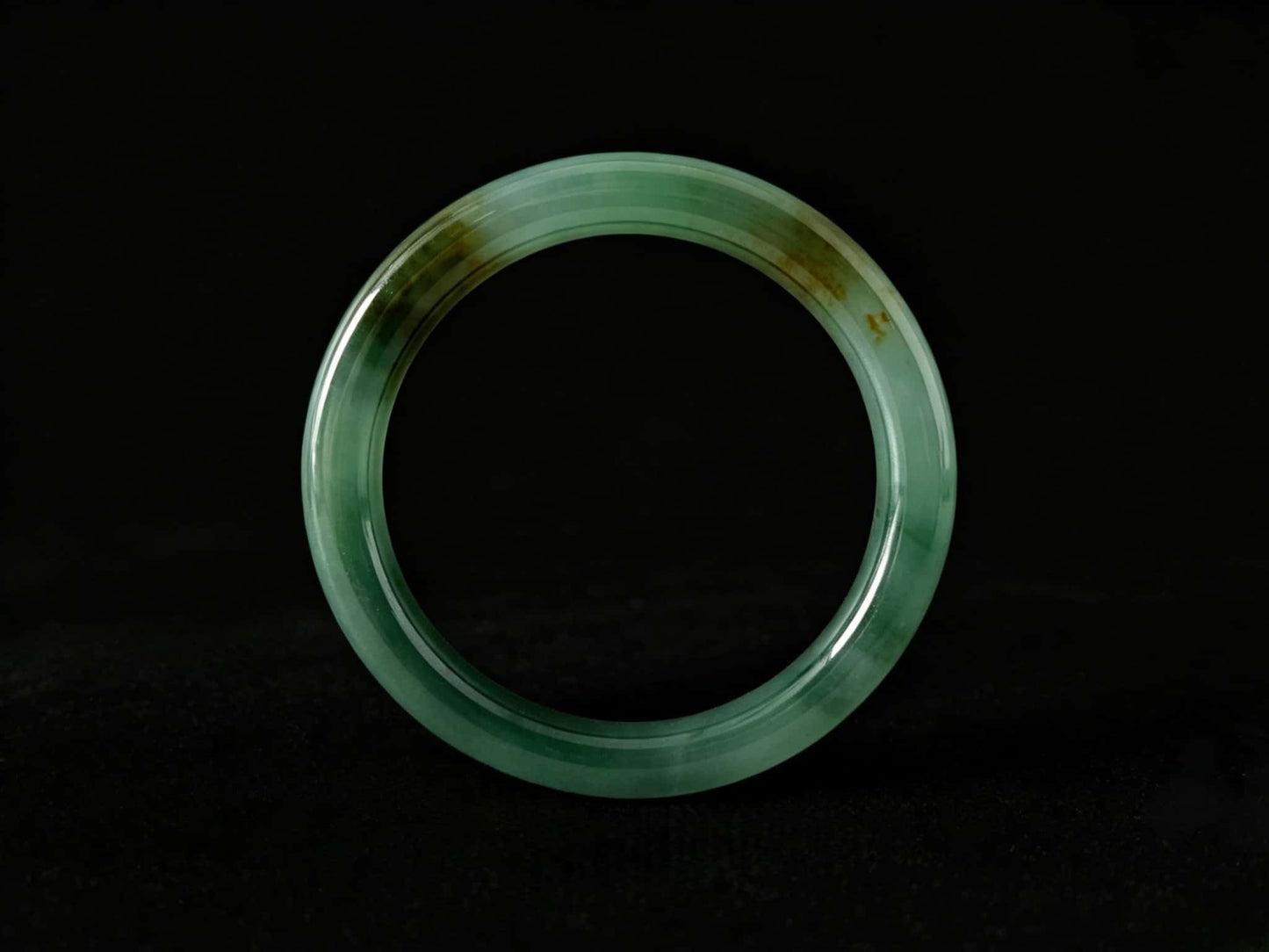 A honey green mist jadeite bangle.