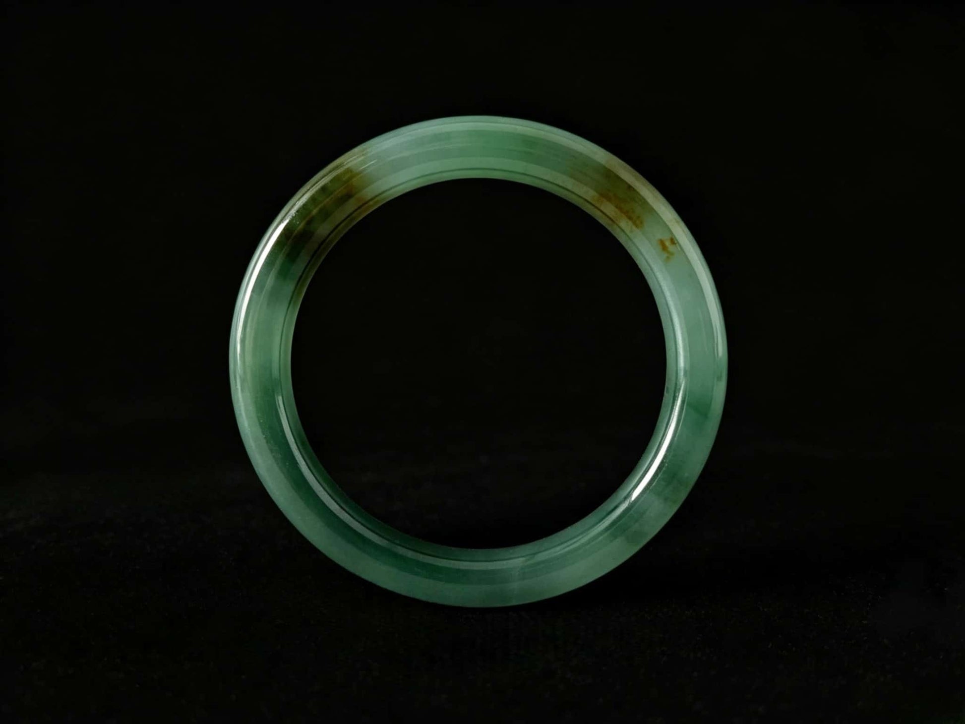 A honey green mist jadeite bangle.