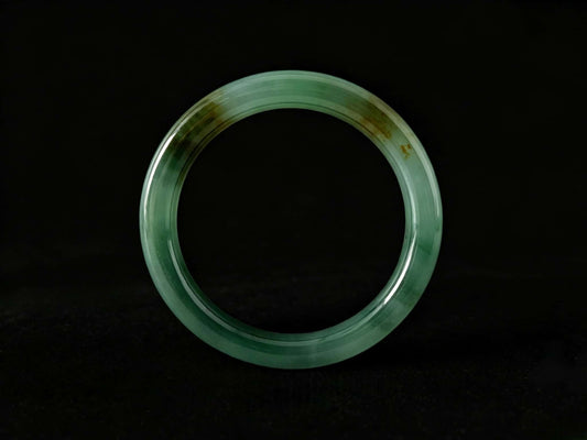 A honey green mist jadeite bangle.