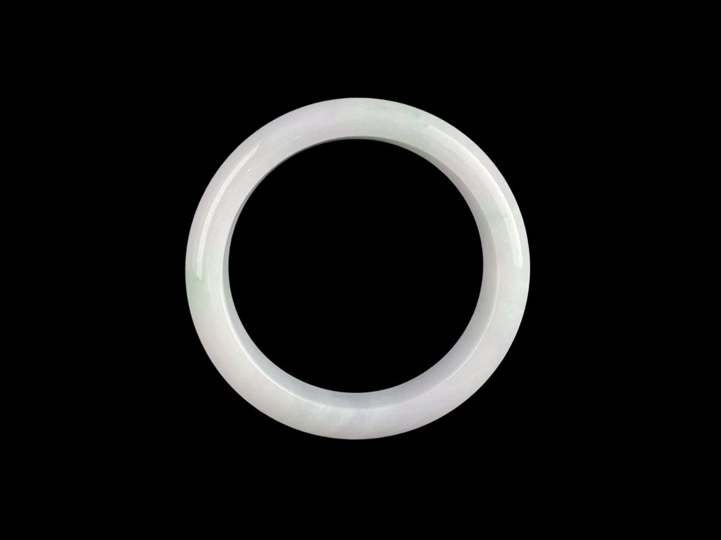 A pristine white with green veil jadeite bangle.