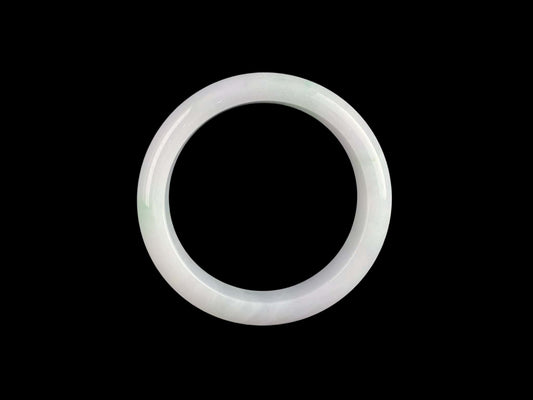 A pristine white with green veil jadeite bangle.