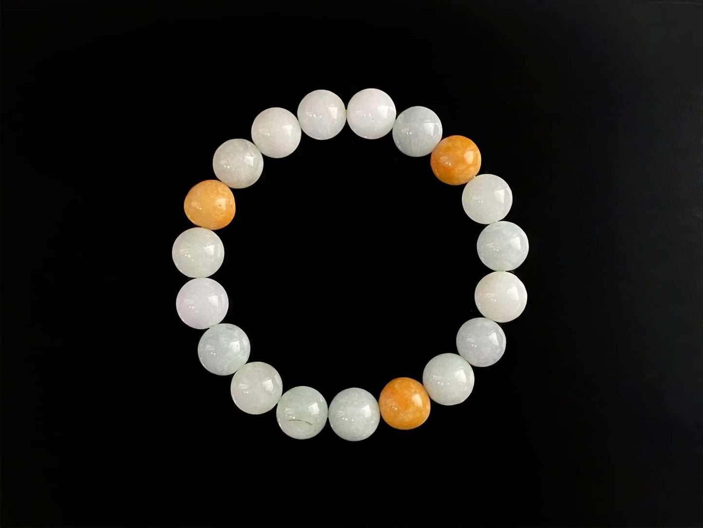 A four hues harmony jadeite beads bracelet.
