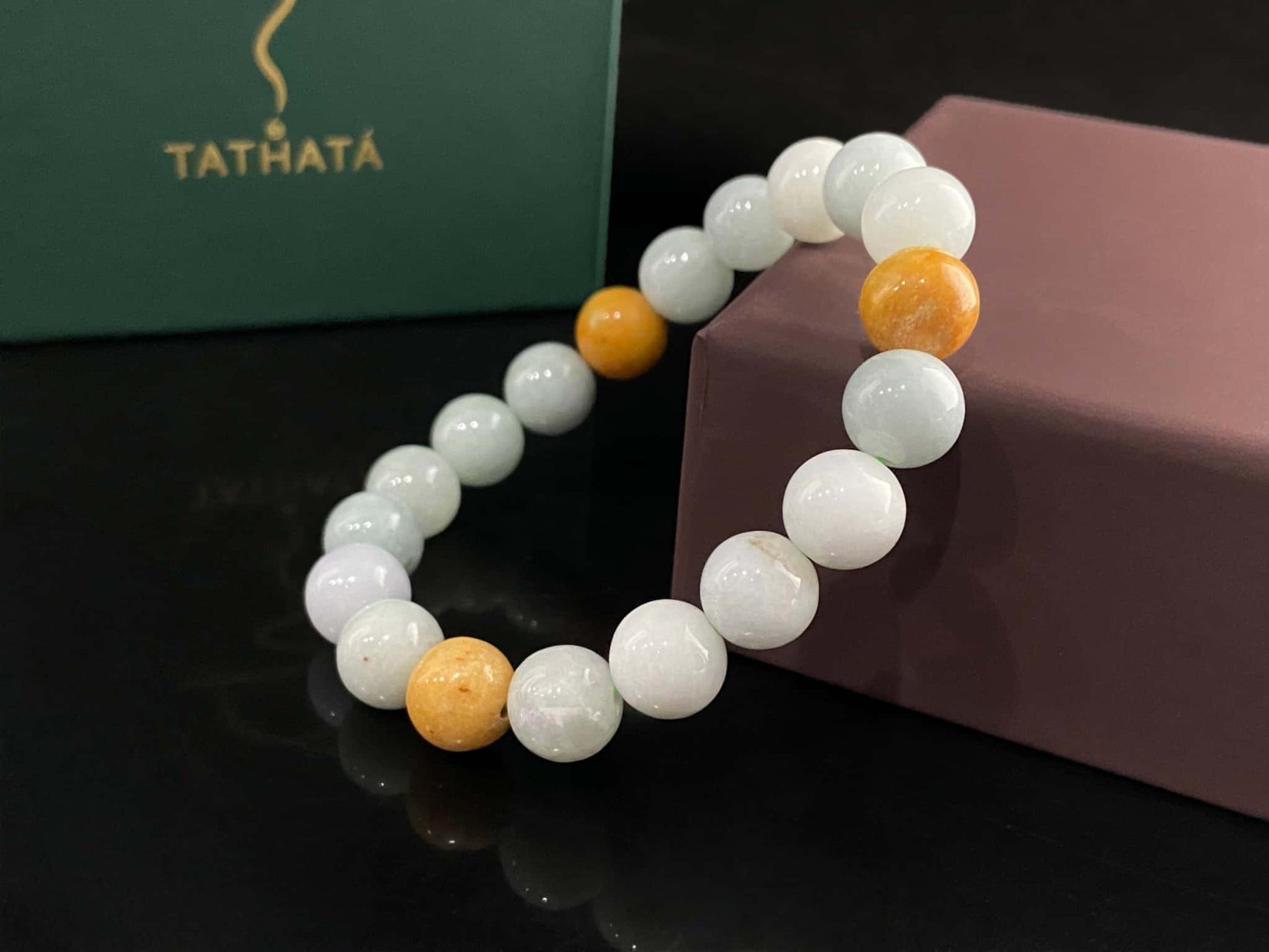 A four hues harmony jadeite beads bracelet.