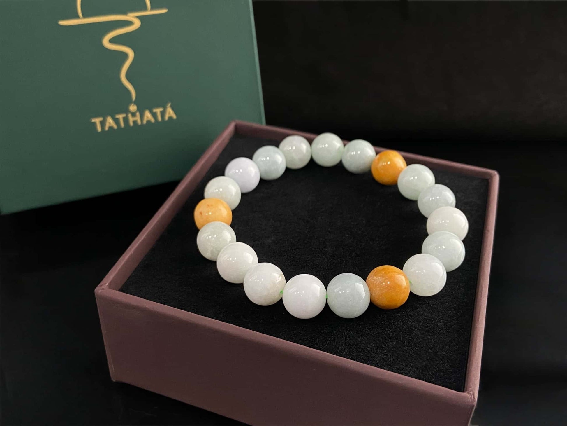 A four hues harmony jadeite beads bracelet.