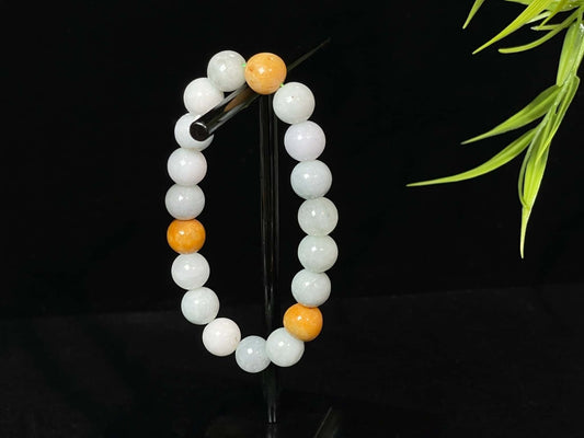 A four hues harmony jadeite beads bracelet.