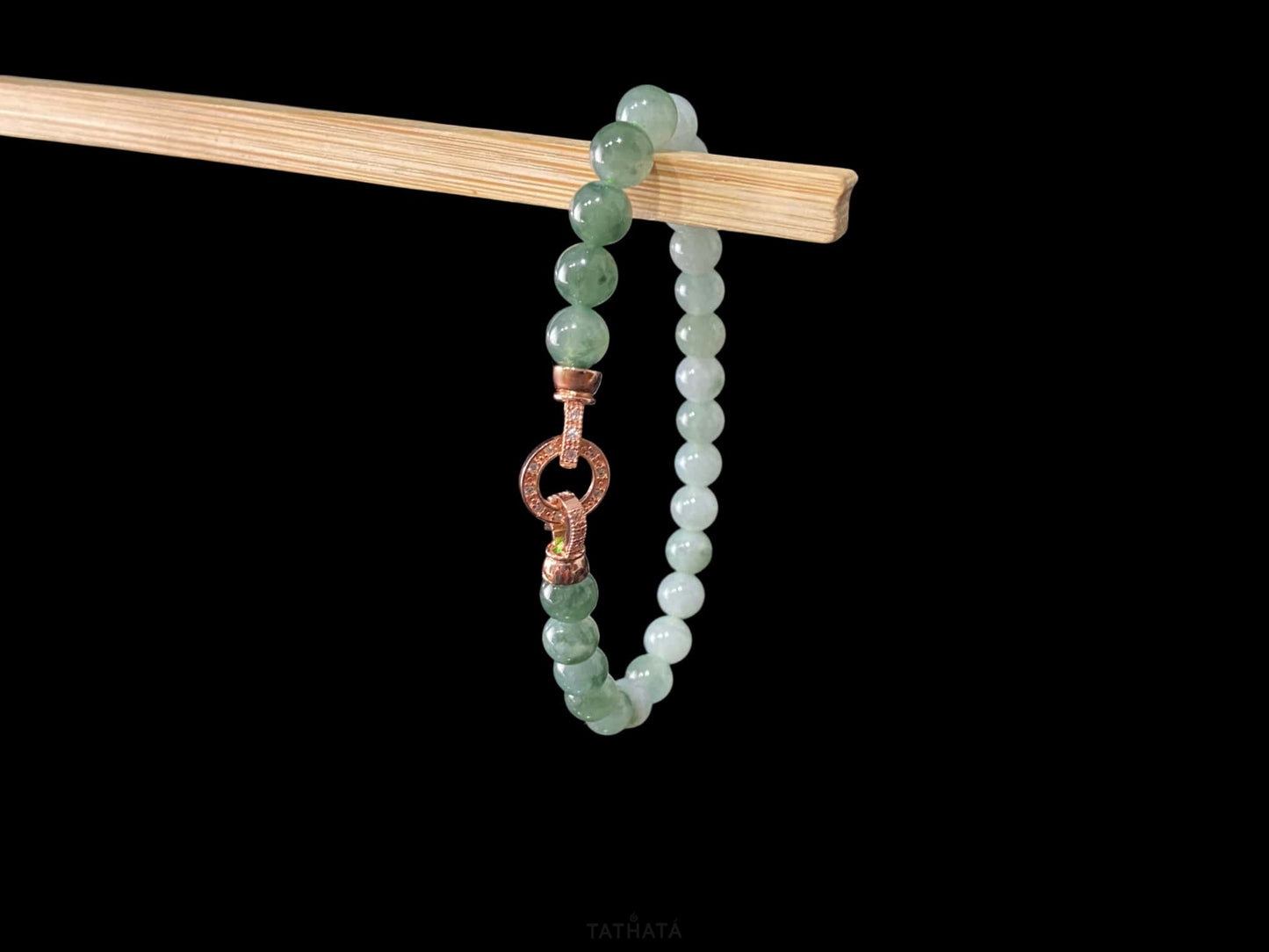 A floating green gradient jadeite beads bracelet.