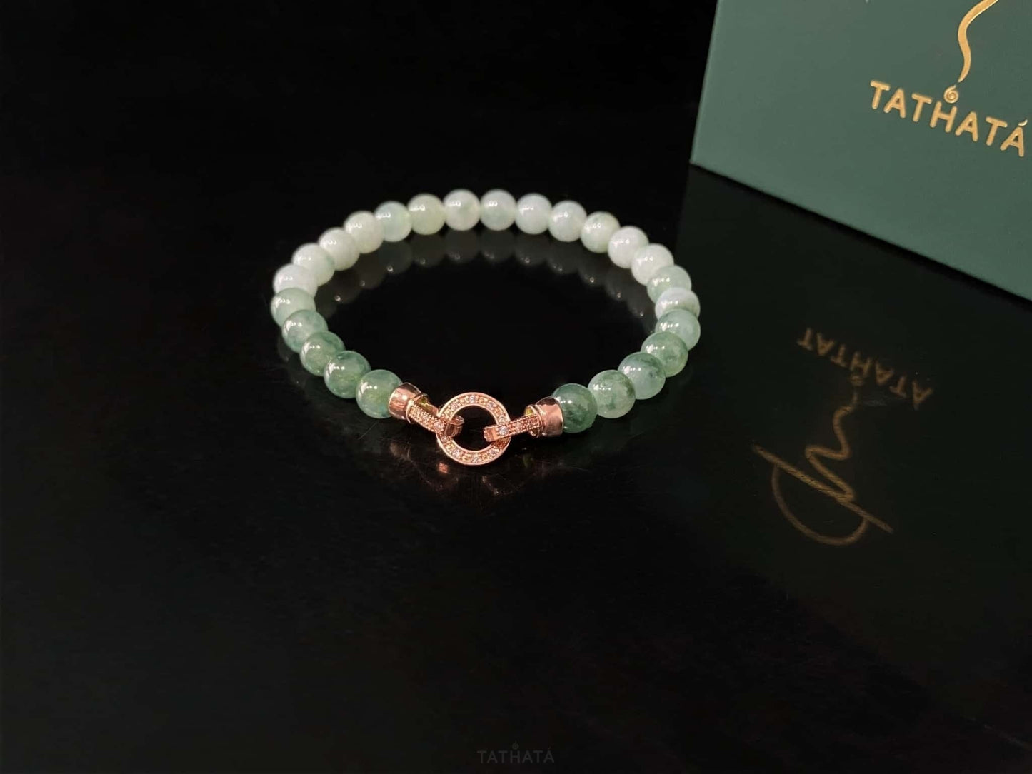 A floating green gradient jadeite beads bracelet.