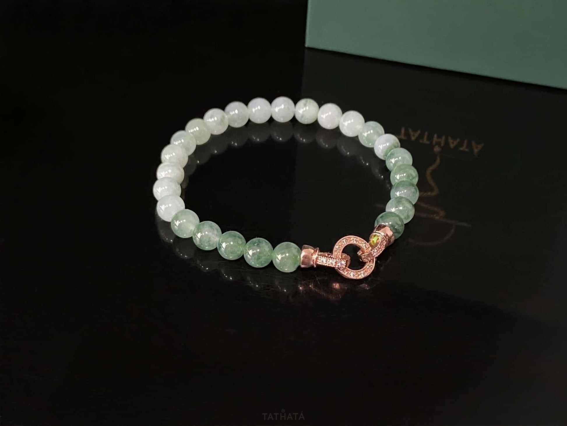 A floating green gradient jadeite beads bracelet.