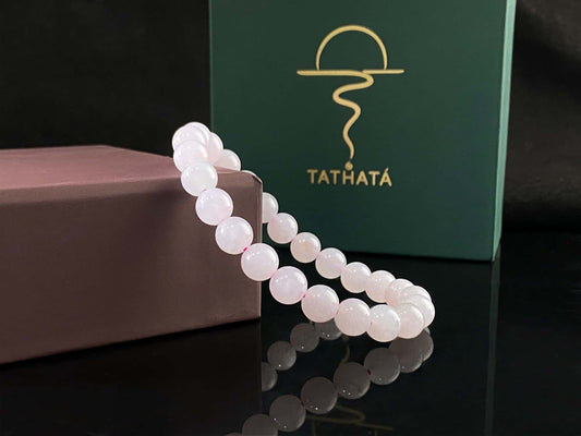 A clear white with pink thread jadeite beads bracelet.