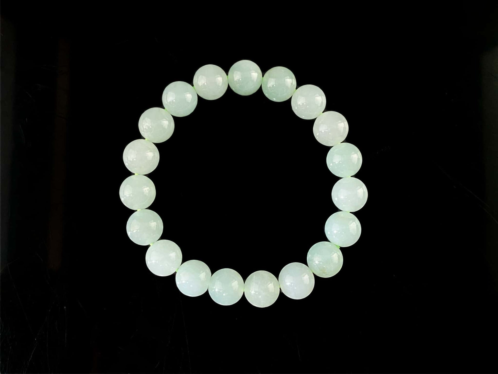 A milky pale green calm jadeite beads bracelet.