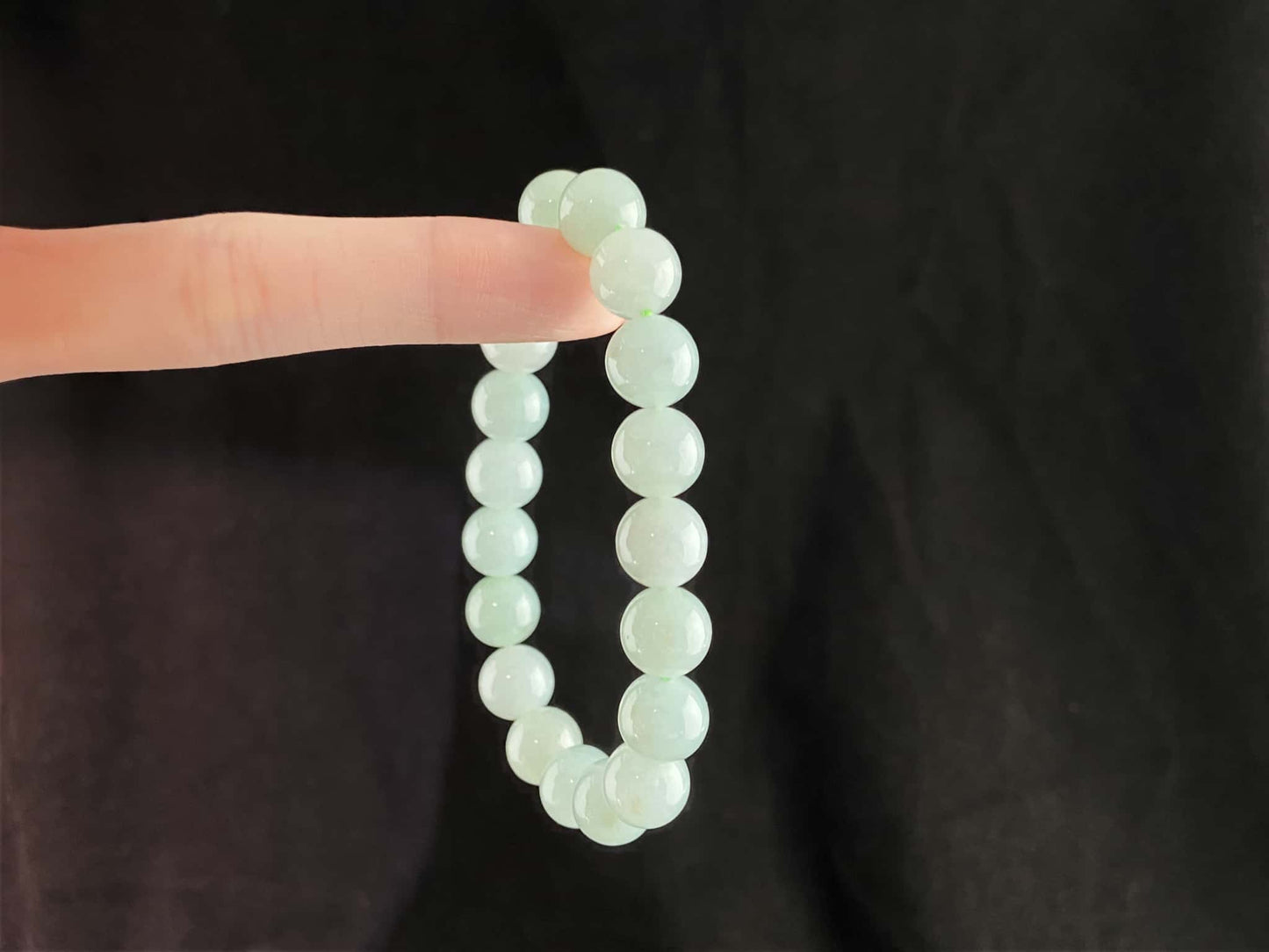 A milky pale green calm jadeite beads bracelet.