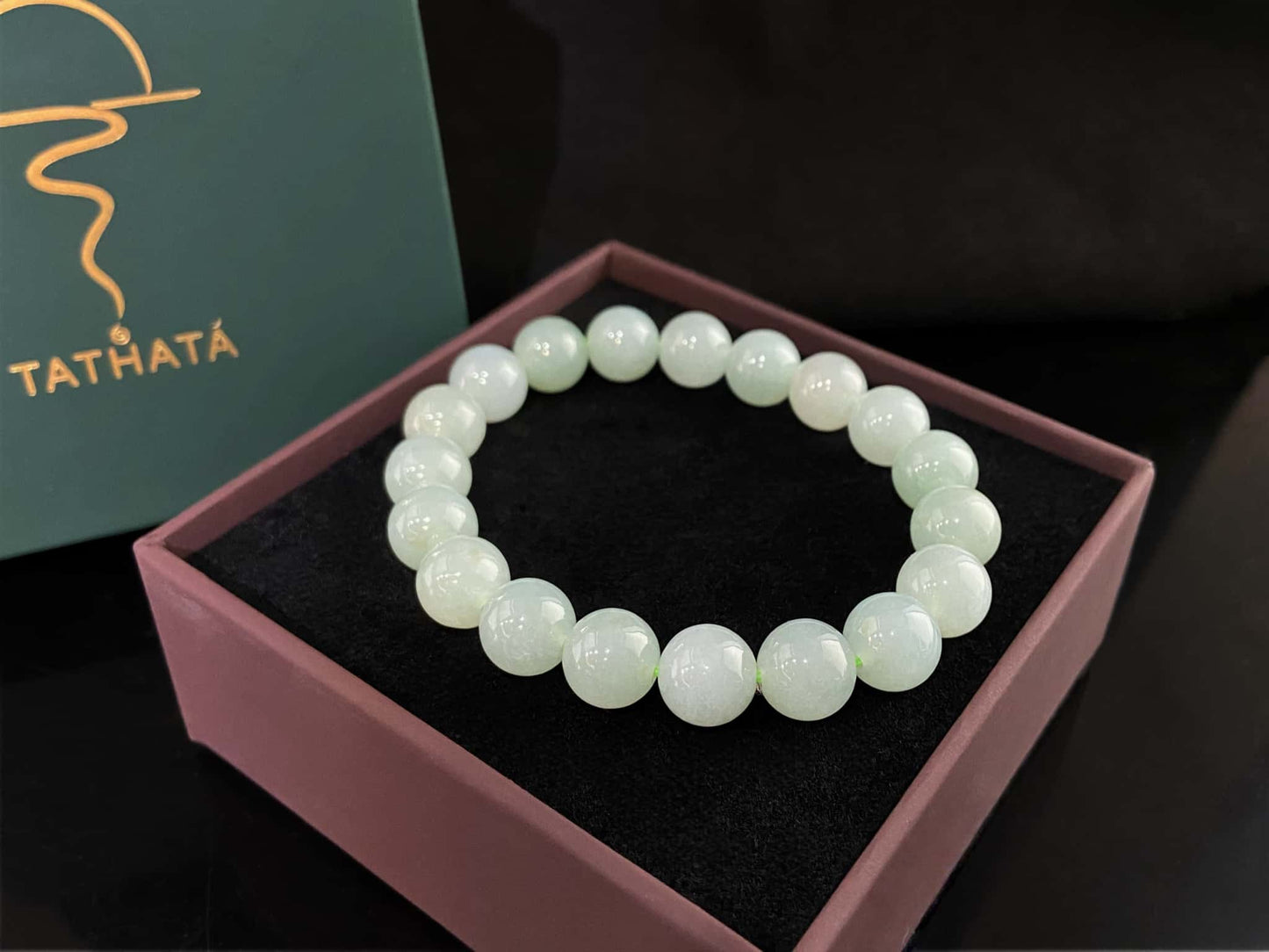 A milky pale green calm jadeite beads bracelet.
