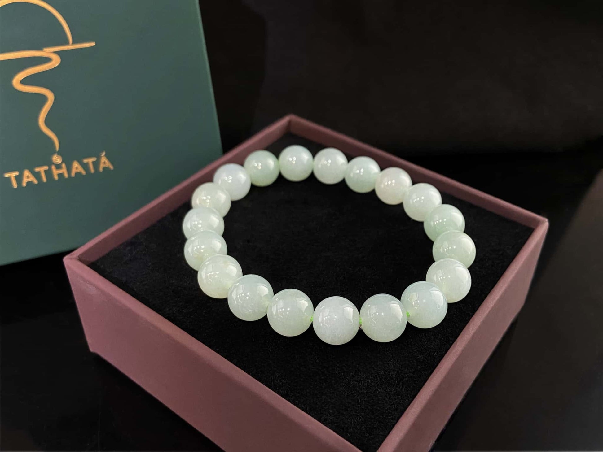 A milky pale green calm jadeite beads bracelet.