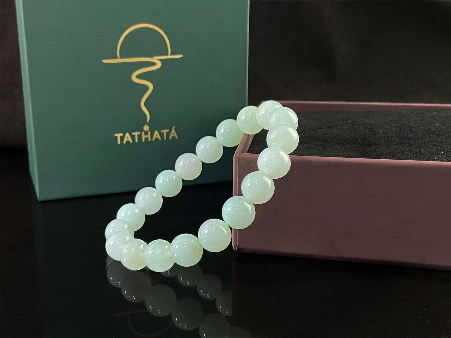 A milky pale green calm jadeite beads bracelet.