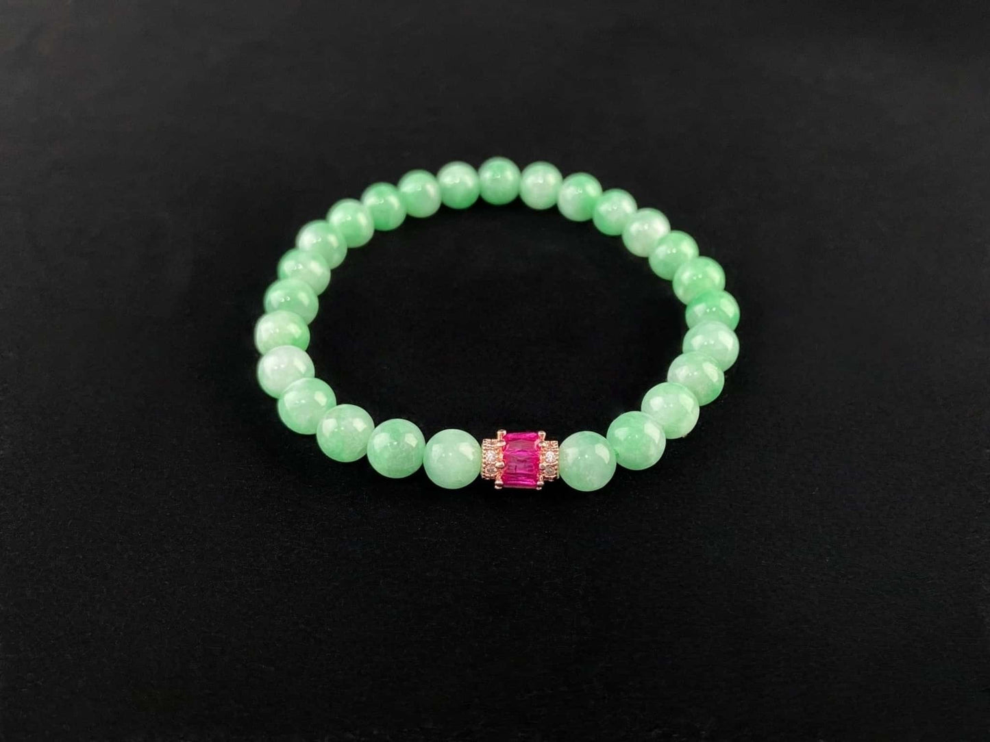 A pale mint and pink spark jadeite beads bracelet.