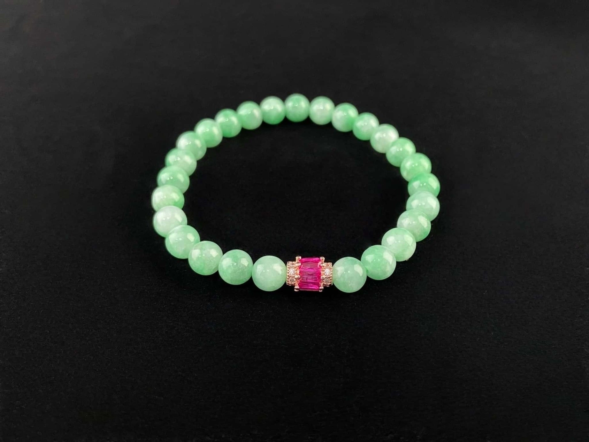 A pale mint and pink spark jadeite beads bracelet.