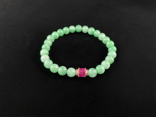 A pale mint and pink spark jadeite beads bracelet.