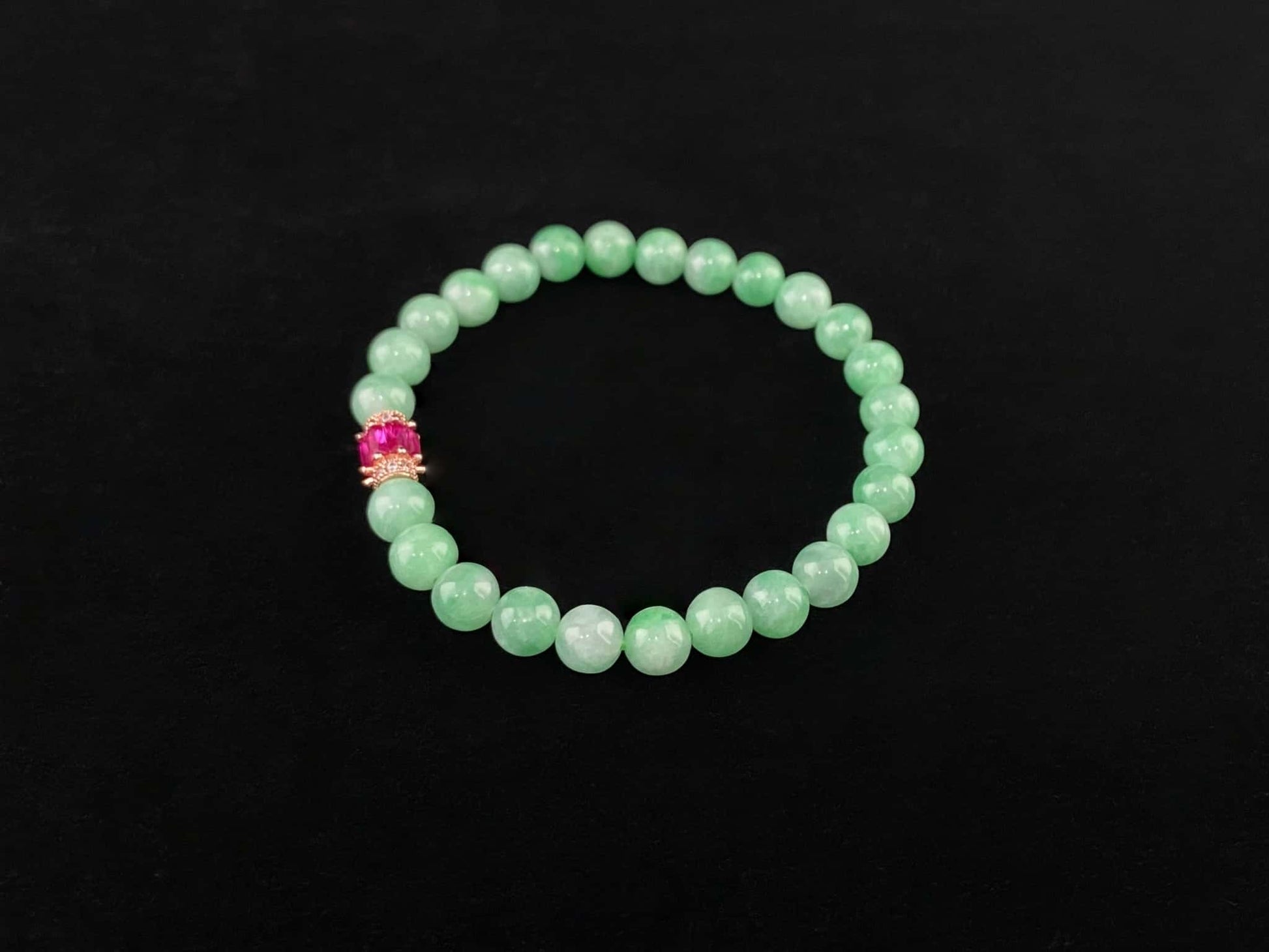 A pale mint and pink spark jadeite beads bracelet.